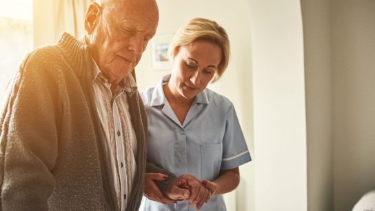 care taker helping patient
