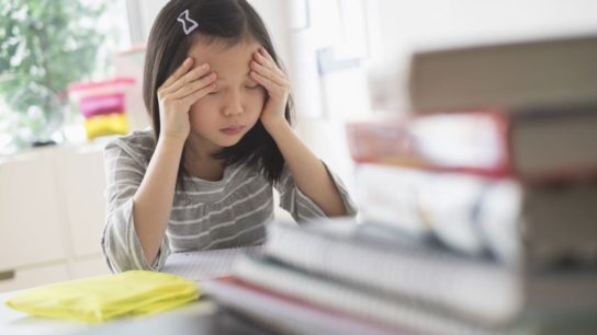 young girl with headache