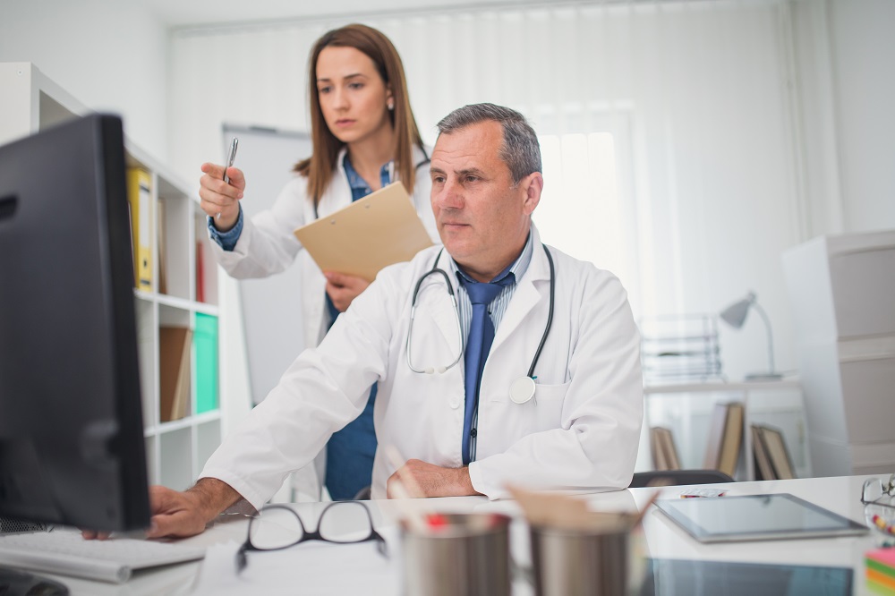 Clinicians registering on computer