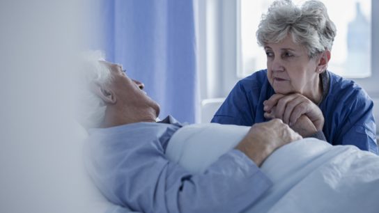 woman in hospital visiting husband