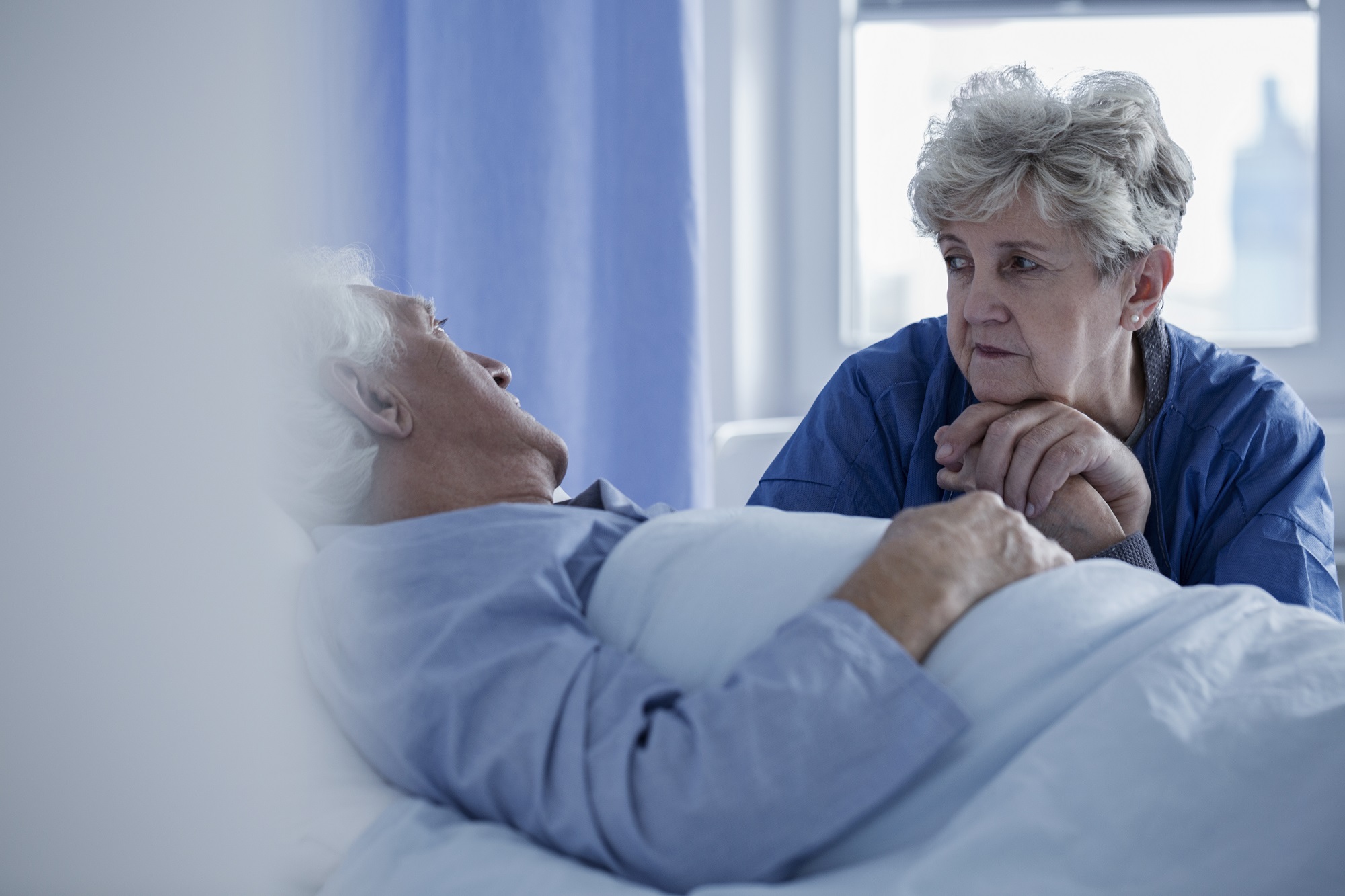 woman in hospital visiting husband