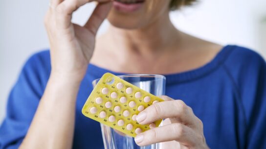 woman-taking-birth control-pill