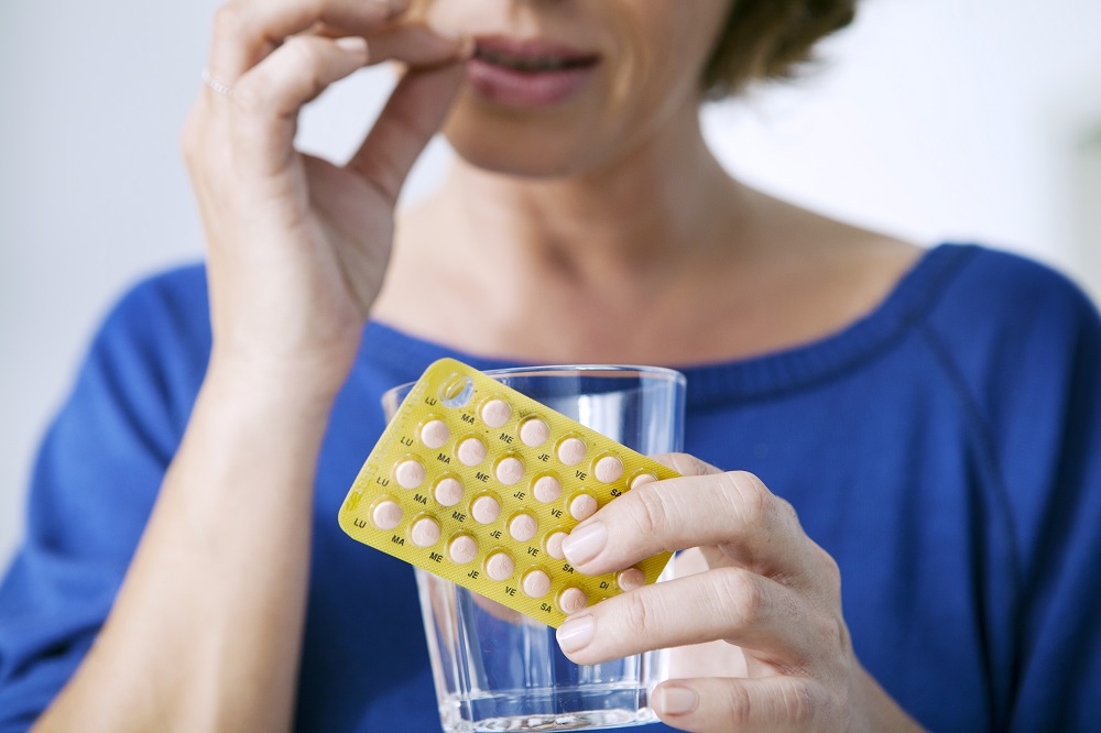 woman-taking-birth control-pill