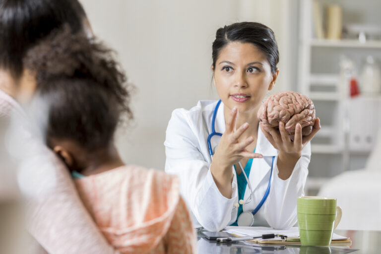 Neurologist and pediatric patient