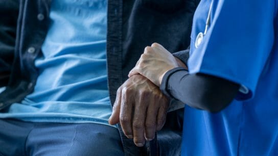 nurse-holding-patient-hand