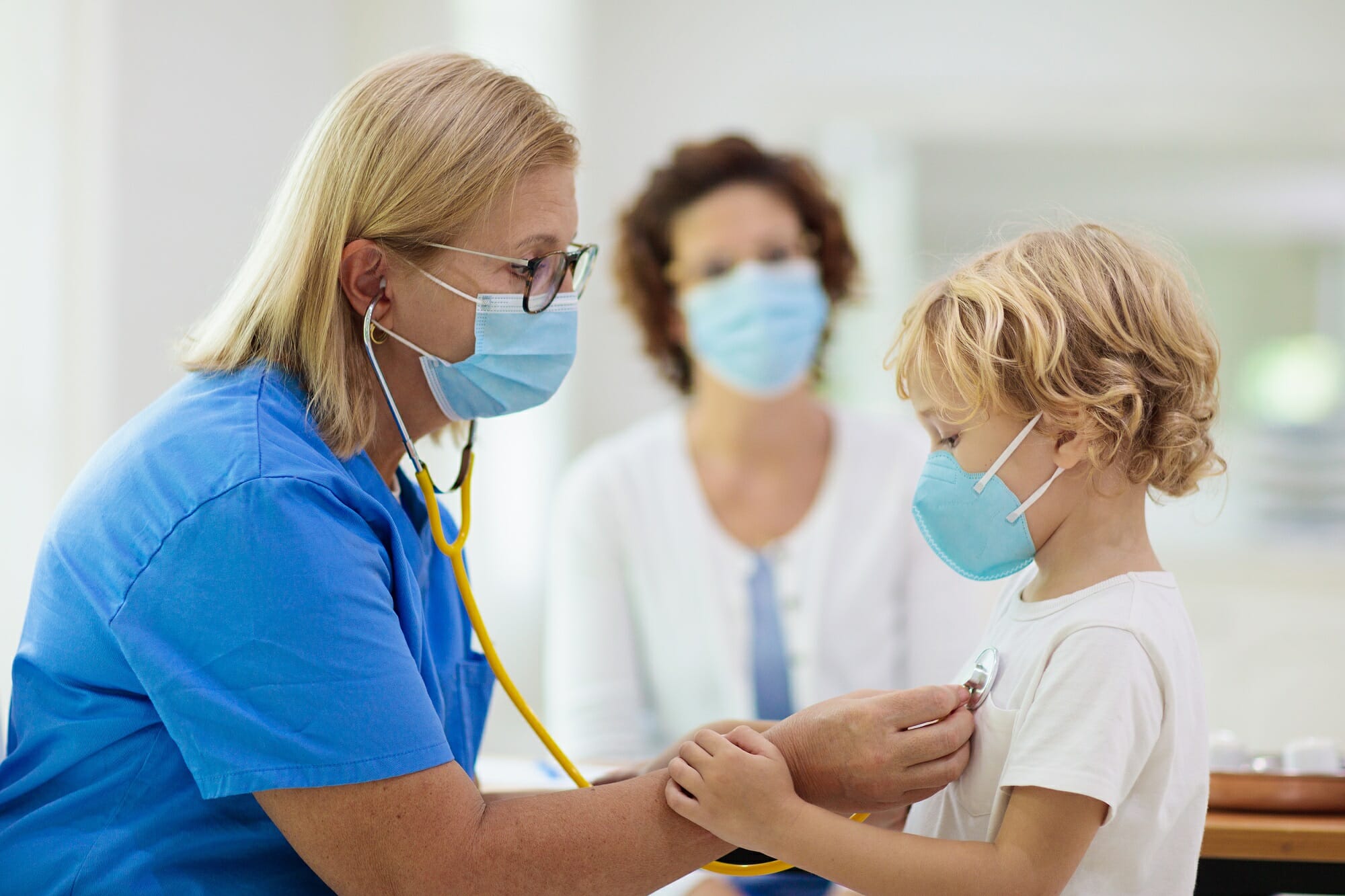 pediatrician examining pediatric patient