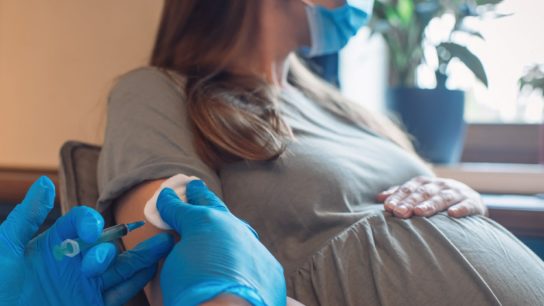 pregnant woman receiving vaccine