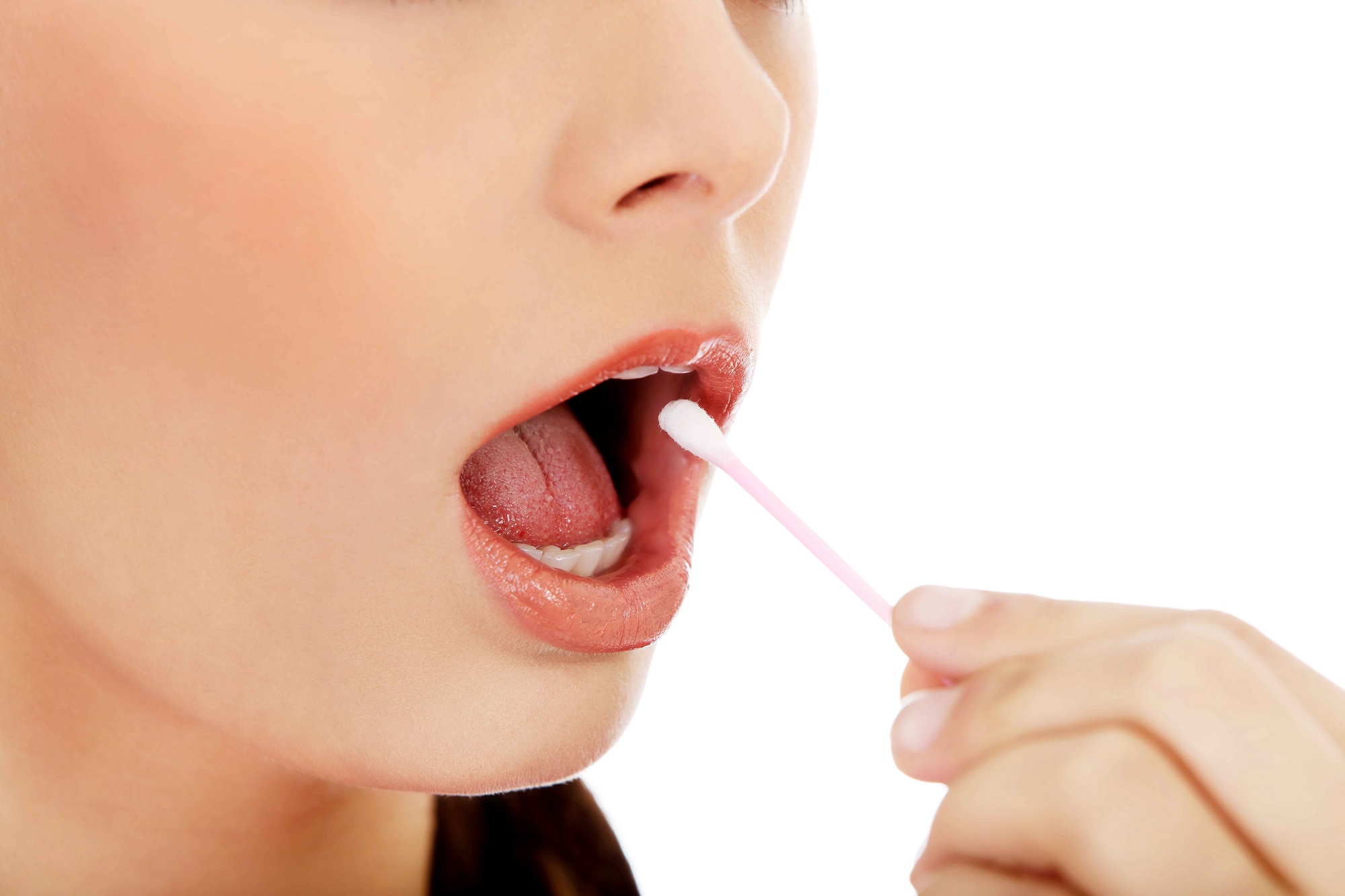 woman putting qtip in her mouth