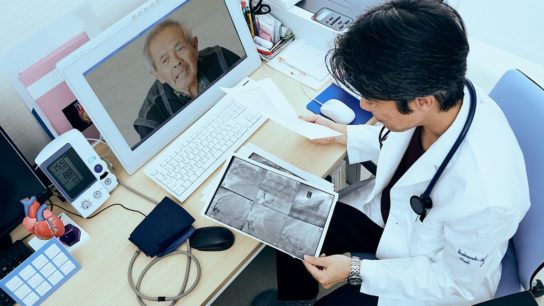 Telemedicine doctor looking at x-ray