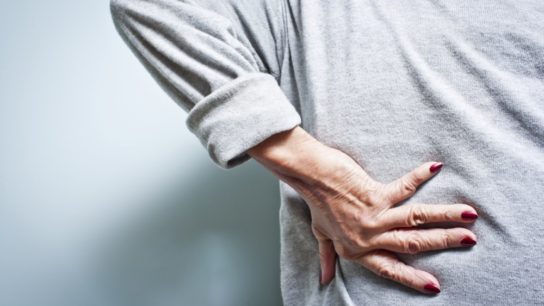 woman back pain elderly