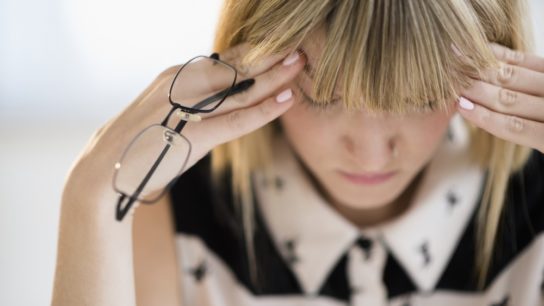 woman headache migraine head pain stress
